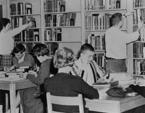 Pictured are some of our first students as they study in the library.