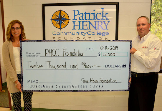 Tiffani Underwood, Executive Director of the PHCC Foundation with Jay Garber, Sales Engineer for Phillips Corporation