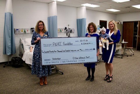 P&HCC Foundation Executive Director Tiffani Underwood accepts a scholarship endowment check from the family of D. Victor Williams, Jr. pictured with Shirley Williams (wife), Carson Victoria (grand daughter), and Courtney Williams (daughter). 